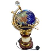 An inlaid globe on stand, the countries inlaid with various stones to include turquoise, jaspers,