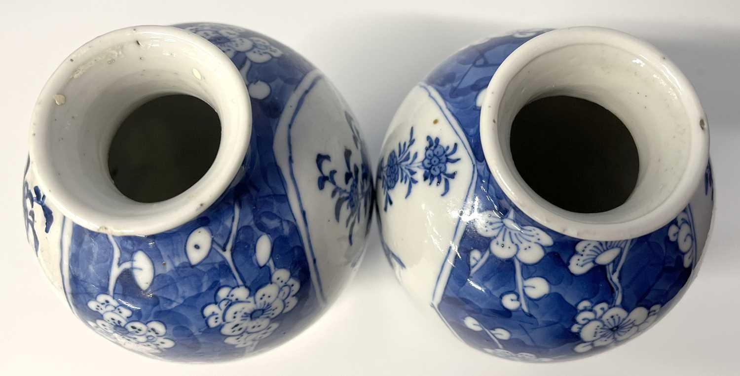 A pair of small Chinese porcelain vases in Qing Shi style with panels decorated with precious - Image 5 of 8