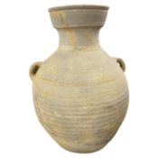 A Roman terracotta wine amphora of ribbed form, 34cm high