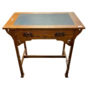 A small Arts & Crafts style oak single drawer writing table with metal handles raised on tapering