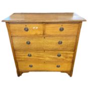 An Arts & Crafts style oak chest with two short and three long drawers fitted with ringlet