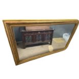 Large 19th Century gilt framed over mantel mirror of arched form, the frame with moulded and