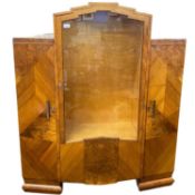 An Art Deco style walnut veneered display cabinet with central glazed section and side cupboards,