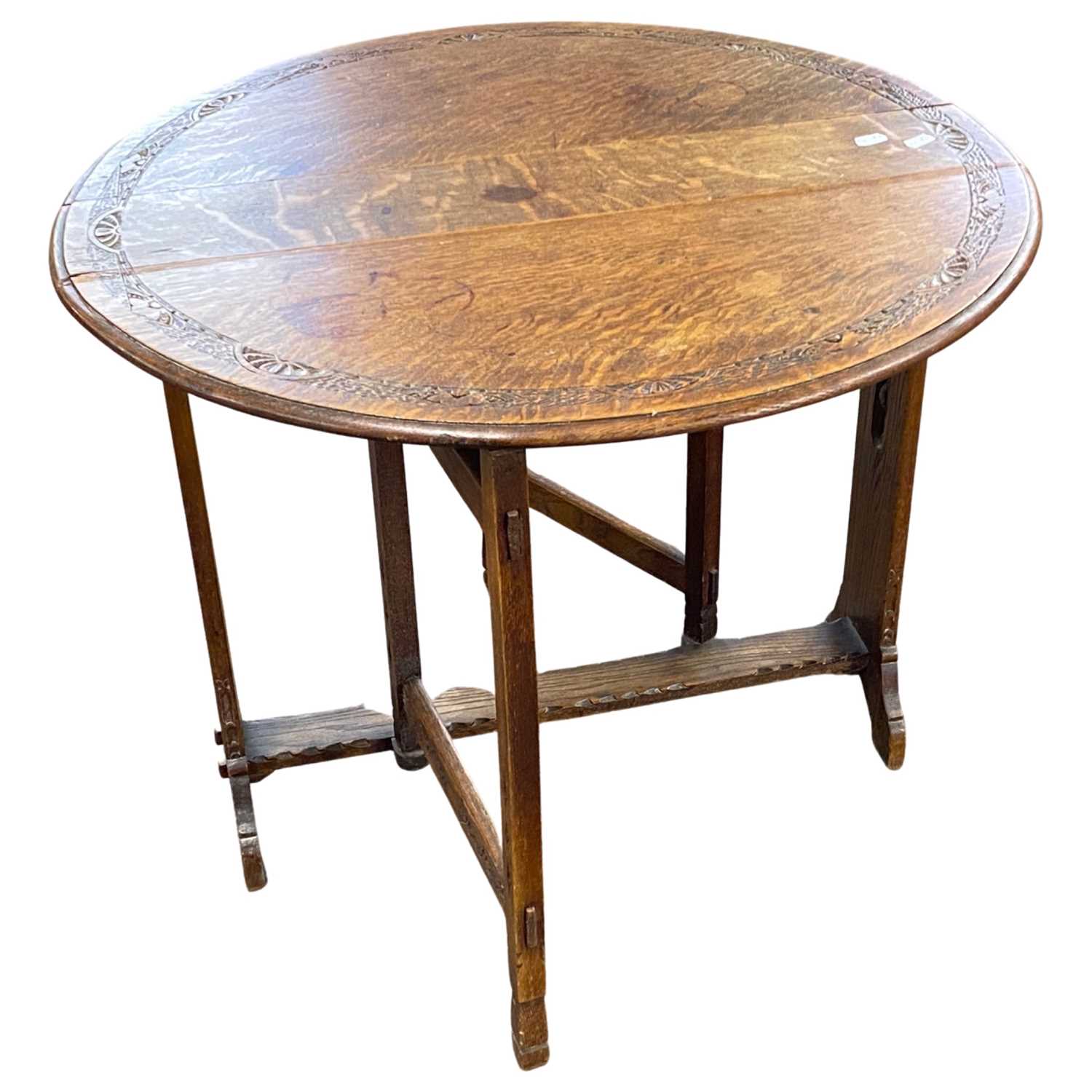 A late 19th Century Arts & Crafts style oak drop leaf occasional table of oval form with pierced - Image 3 of 4