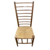 A Arts & Crafts style rush seat ladder back chair, 100cm high