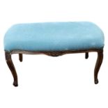 A 19th Century continental stool with blue upholstered top and carved cabriole legs