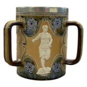 Doulton Lambeth stone ware tyg decorated with panels of atheletes fitted with a silver plated rim,