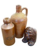 A ginger beer bottle Bourne Denby marked Caley together with a stoneware flask and a treacle