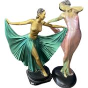 Two painted plaster Art Deco models of ladies on black bases, tallest 42cm high