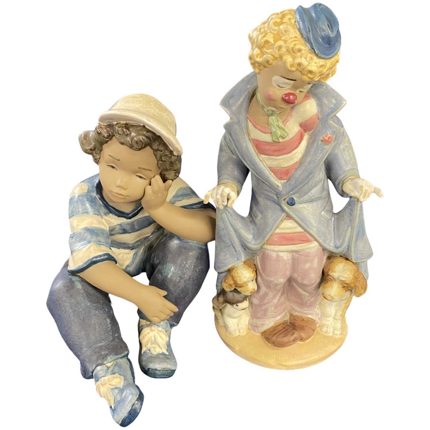 Lladro model of a clown together with a Lladro model of a young boy with baseball cap, the clown
