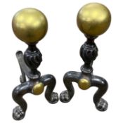 A pair of cast iron and brass mounted fire dogs, 36cm high