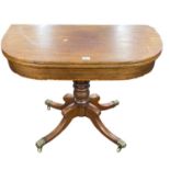 A 19th Century mahogany pedestal tea table with folding top over a turned column and outswept legs
