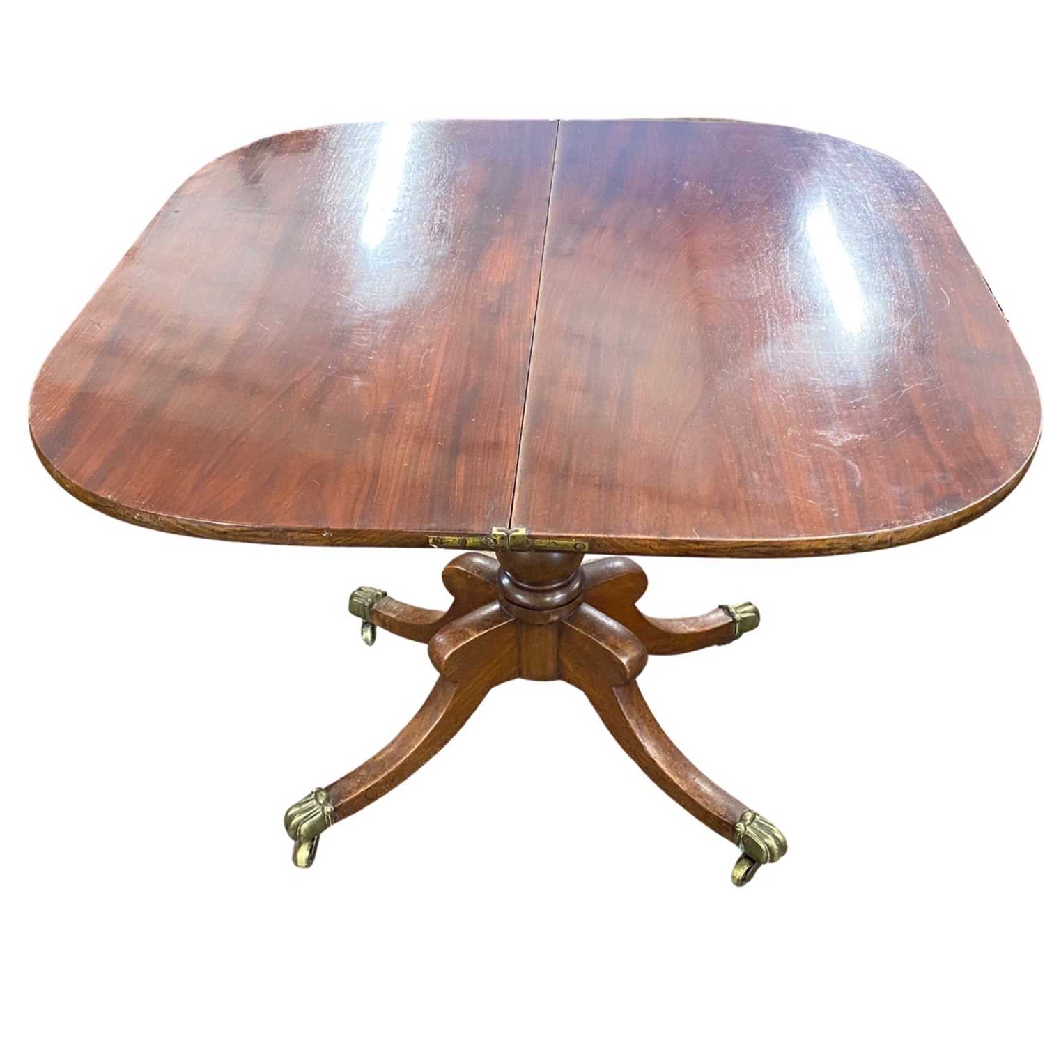 A 19th Century mahogany pedestal tea table with folding top over a turned column and outswept legs - Image 4 of 4