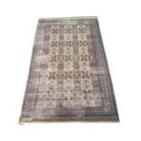 20th Century Middle Eastern shallow pile rug decorated with a central panel of stylised foliage