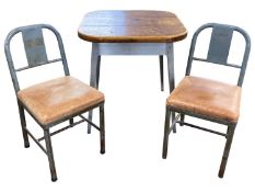A 20th Century industrial style metal framed dining table with pine top together with two