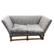 Antique style blue upholstered sofa with loose cushions