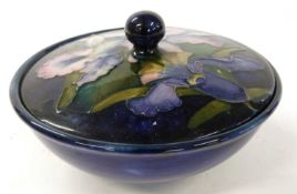 Mid 20th Century Moorcroft box and cover decorated with the orchid design on a blue ground, 17cm