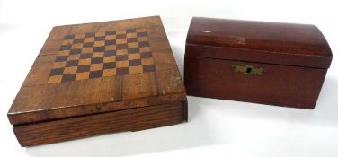 Box containing quantity of carved wooden chess pieces together with a further wooden chess board and