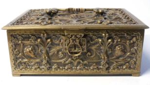 An impressive brass jewellery box heavily decorated in relief with Art Nouveau style symbols to