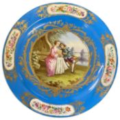 Sevre style dish, the blue ground with gilt decoration with central panel of a suitor and girl