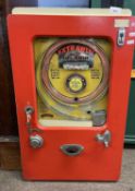 A vintage Extrawin wall mounted pinball machine in red and cream painted case, 75cm high