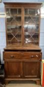 A Georgian mahogany secretaire bookcase cabinet with glazed top section over a base with