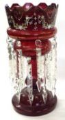 A ruby coloured table lustre with painted floral decoration, 36cm high