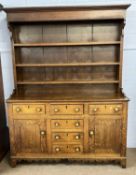 Late 19th Century oak Welsh dresser the top section with moulded cornice over three shelves, the