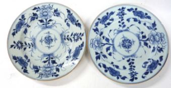 A pair of Chinese porcelain blue and white plates with ochre rims, possibly 18th Century, 23cm