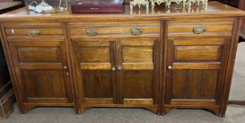 Late 19th Century American walnut sideboard with three drawers and four panelled doors, 178cm wide