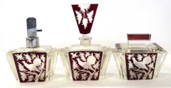 A 1920's Art Deco perfume set comprising a jar and cover, further atomiser and a further jar with