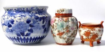 A Japanese porcelain jardiniere with blue and white floral decoration together with a small