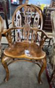 Reproduction Gothic style Windsor chair with arched back, front cabriole legs and crinoline