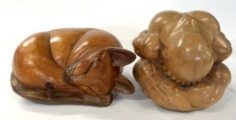 Two further wooden carvings, one of a cat and further carving of a man