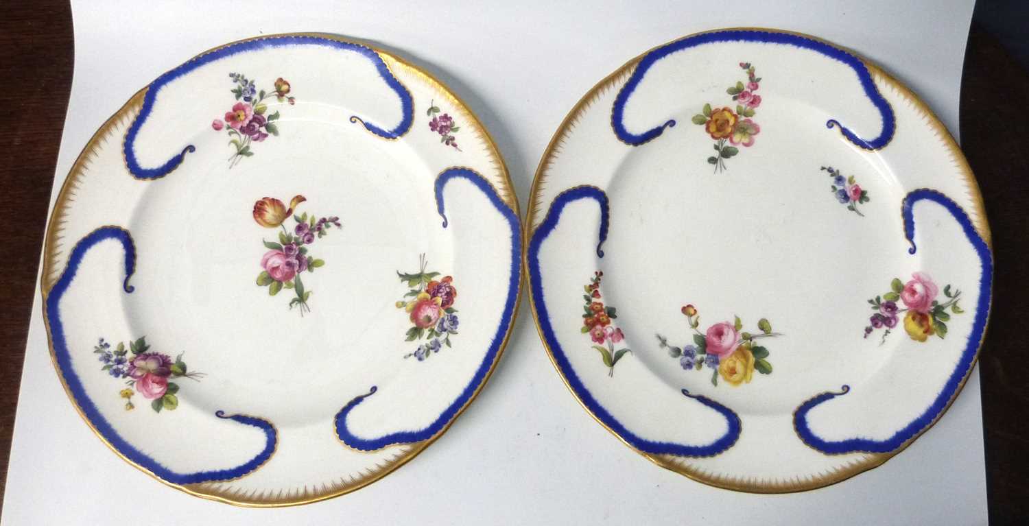 A pair of Sevres style plates retailed by T Good & Co, 24cm diameter