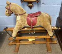 A 1970s plush rocking horse on wooden base, purchased by vendor from Hamley's, Regent Street.