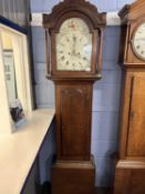 Fuller, Watton, a Georgian long case clock with painted arch dial to a brass eight day movement, set