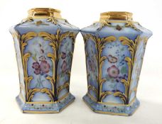 A pair of Royal Doulton vases the blue ground with floral decoration, 15cm high