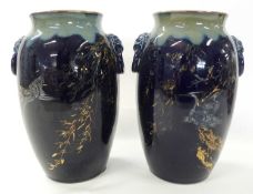 A pair of continental porcelain vases, the blue ground decorated with flowers, birds and insects