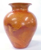 An interesting pottery globular vase in a orange skin glaze in Ruskin pottery style, indistinct