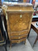 A 19th Century French marble top and serpentine front side cabinet with drop down front over three