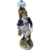 Derby style model of a street seller, continental with pseudo Derby mark to base, 18cm high