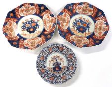 A pair of Japanese Imari dishes of fluted form with Imari style decoration together with a further