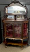 Edwardian mahogany mirror back display cabinet with arched back over a body with two doors and