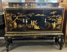 Early 20th Century black lacquered sideboard in the Chinoiserie style with a three door body