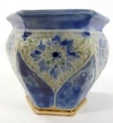 A small Royal Doulton slip cast vase circa 1930's with floral design on blue ground, 10cm high
