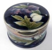 A Moorcroft box and cover with Sheffield plated rim by Hutton, the Moorcroft body decorated with