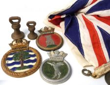 Box containing a Union Jack and some brass weights and ships medallions for Malcolm & Capprice etc