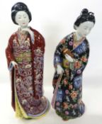 A pair of continental porcelain figures of standing Geisha figures, 42cm high