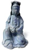 Pottery model of Chinese Deity in a blue glaze, 22cm high